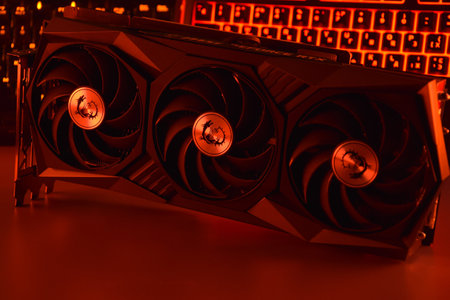 UKRAINE, KHARKIV, NOVEMBER 14, 2022: MSI Geforce RTX 3090 Ti gaming X TRIO graphics card, dark background. Hardware components for build PC or mining rig.のeditorial素材