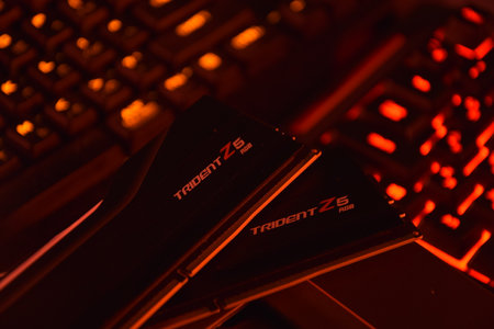 UKRAINE, KHARKIV, NOVEMBER 14, 2022: G.Skill ddr5 trident z5 rgb desktop memory pack on backlit keyboard background.のeditorial素材