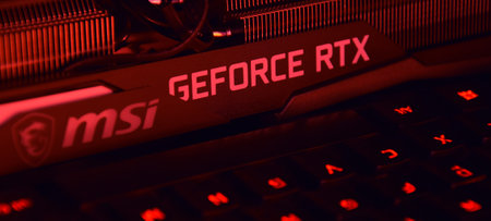 UKRAINE, KHARKIV, NOVEMBER 14, 2022: MSI Geforce RTX 3090 Ti gaming X TRIO graphics card, dark background. Hardware components for build PC or mining rig.のeditorial素材