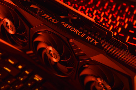 UKRAINE, KHARKIV, NOVEMBER 14, 2022: MSI Geforce RTX 3090 Ti gaming X TRIO graphics card, dark background. Hardware components for build PC or mining rig.のeditorial素材