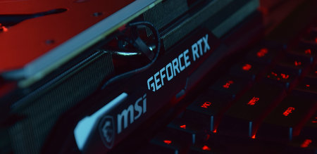 UKRAINE, KHARKIV, NOVEMBER 14, 2022: MSI Geforce RTX 3090 Ti gaming X TRIO graphics card, dark background. Hardware components for build PC or mining rig.のeditorial素材