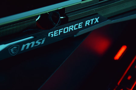 UKRAINE, KHARKIV, NOVEMBER 14, 2022: MSI Geforce RTX 3090 Ti gaming X TRIO graphics card, dark background. Hardware components for build PC or mining rig.のeditorial素材