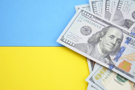 American dollars and Ukrainian hryvnia. The concept of the American aid to Ukraine in the war. The concept of the exchange rate.の写真素材