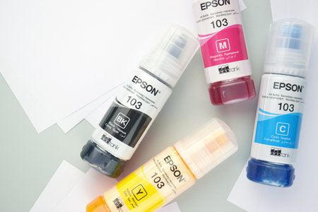 Four bottles of ink Epson, yellow, red, blue, black, built-in to the Epson L3150 series printer.のeditorial素材