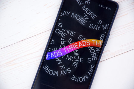 Kharkiv, Ukraine, July 06, 2023: Threads app logo seen on screen. The new application by Meta Platforms is Twitter competitor.のeditorial素材