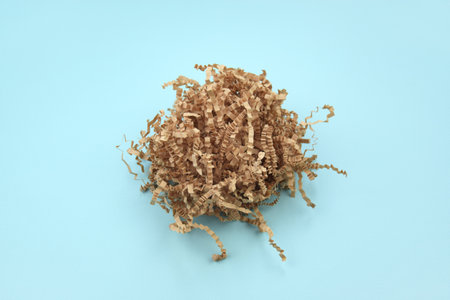 Shredded paper on light blue background. selective focus image.の写真素材