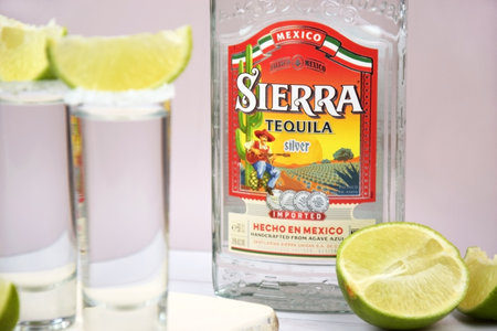Kharkiv, Ukraine, JULY 11, 2023: Bottle of Sierra tequila on a light background. Tequila is a type of alcoholic drink made from the blue agave plant.のeditorial素材
