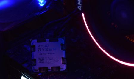 UKRAINE, KHARKIV, NOVEMBER 14, 2022: Close-up of an AMD Ryzen 9 7900X processor, against the backdrop of coolers with light.のeditorial素材