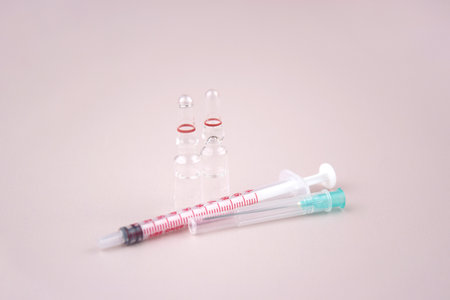 Many medical ampoule on light background. Medicine concept. Vials for medical injection.
