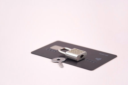 Financial fraud protection concept: credit card, padlock and master key on the light background.の写真素材