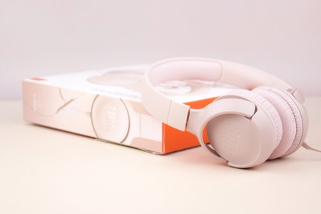 Kharkiv, Ukraine, July 06, 2023: JBL T500 Pink wired headphones with deep bass.のeditorial素材