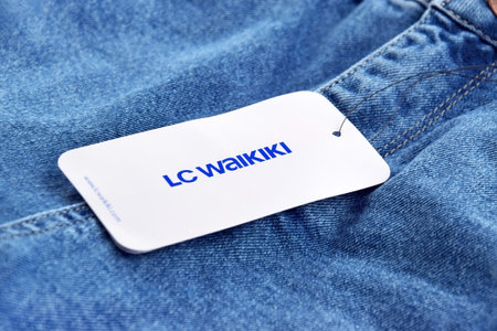 Blue jeans with white tag and LC Waikiki logo.