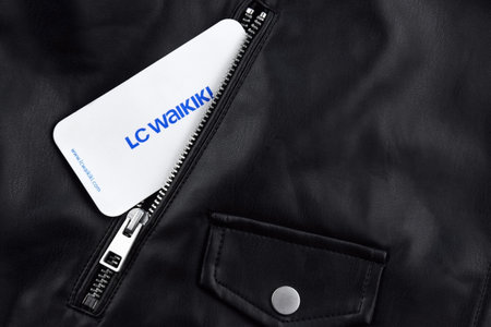 Black leather jacket with white tag and LC Waikiki logo.のeditorial素材