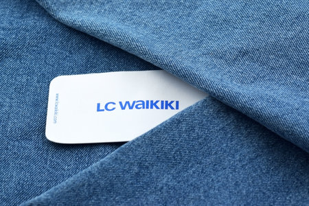 Blue jeans with white tag and LC Waikiki logo.のeditorial素材