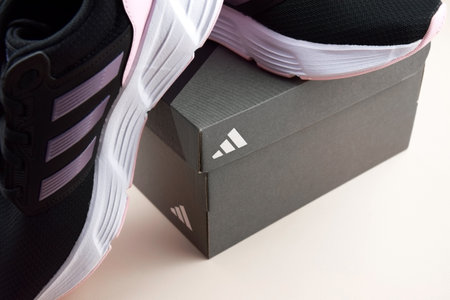 Adidas black and pink womens sports shoes for running.のeditorial素材