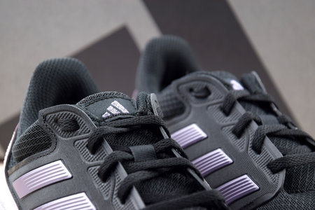 Adidas black and pink womens sports shoes for running.のeditorial素材