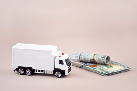 White toy truck with boxes on a light background, space for text.の写真素材