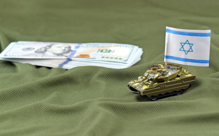 A battle tank with the Israeli flag on a background of US dollar banknotes. The concept of military...