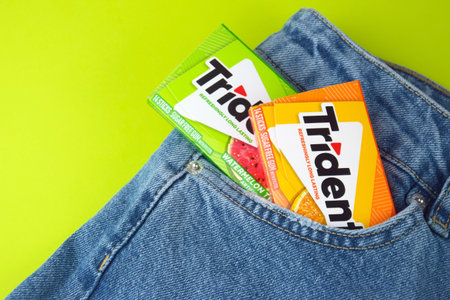 Trident chewing gum on jeans background.