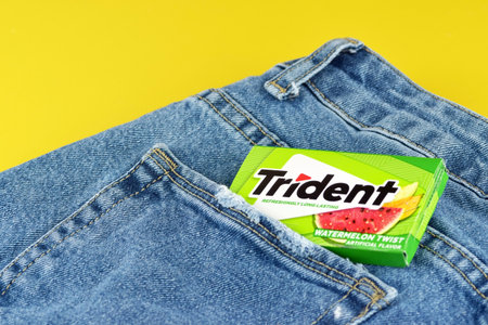 Trident chewing gum on jeans background.