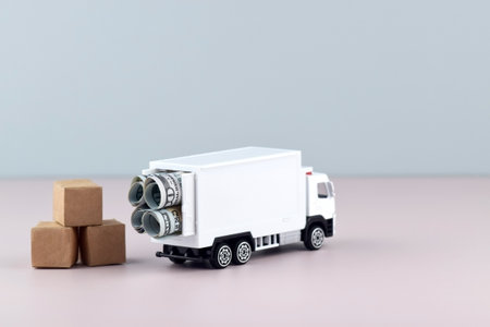 White toy truck with boxes on a light background, space for text.の写真素材
