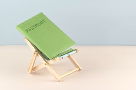 Tourism concept. Chaise lounge with dollars and globe on a light background.