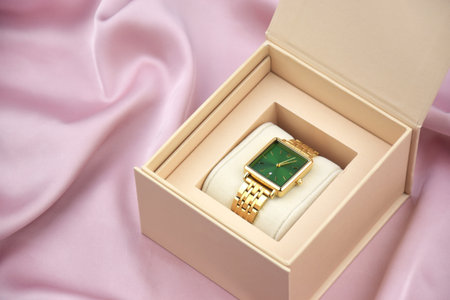 Closeup minimal fashion wristwatch for women on pink background. Fashion and style.の写真素材