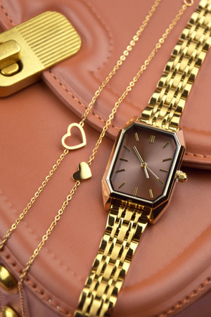 Closeup minimal fashion wristwatch for women on pink background. Fashion and style.の写真素材