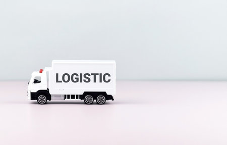 White toy truck on blocks with the text LOGISTIC. Logistics and wholesale trade concept.の写真素材