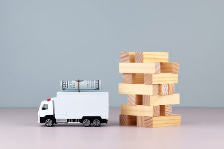 White toy truck with boxes on a light background, space for text. Logistics and wholesale trade concept.の写真素材