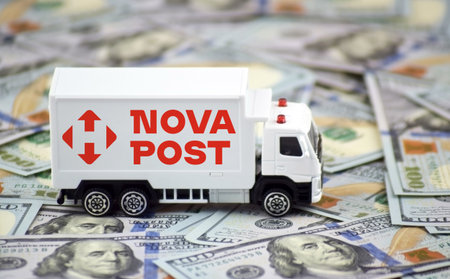 A white toy truck with the NOVA POST logo and boxes on a light background.のeditorial素材