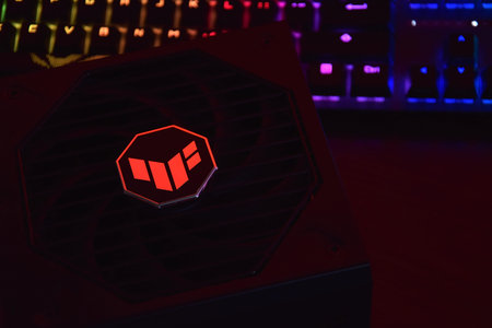 Computer AC power supply Asus Tuf 850w on a dark background.