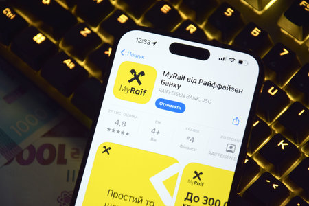 Kharkiv, Ukraine - October 15, 2025: A Ukrainian Raiffeisenbank app on a smartphone screen.