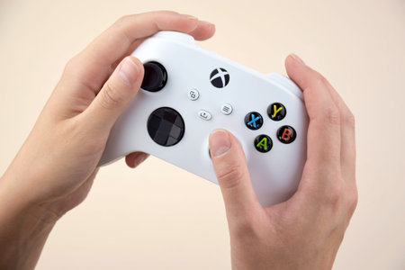 Kharkiv, Ukraine - July 10, 2025: The white Xbox controller on the beige background.