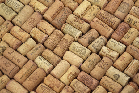 Kharkiv, Ukraine - September 15, 2025: A lot of bottle caps from different wine producers.