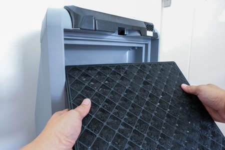 Air purifier. Maintenance the air filter. Replace the charcoal filter.