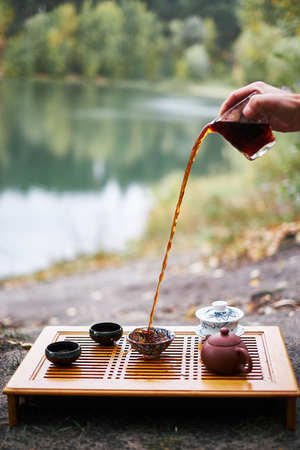 tea ceremony splash on campfire backgroundの写真素材