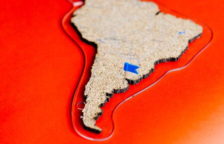 Cork world map showing the Argentina with colored drawing buttonsの写真素材