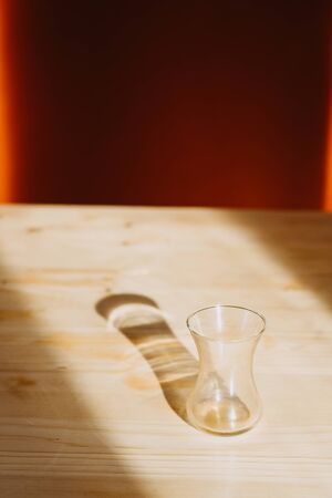 Turkish glass bowl on the table backlit by the sun. Close-upの写真素材