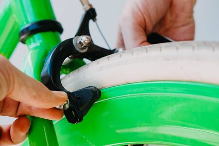  brake repair green fix bike with white tires. Close-upの写真素材