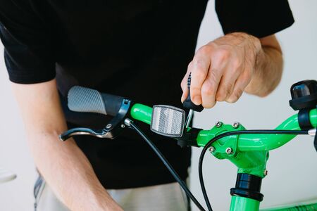 Installation of a front reflective green fix bike with white tiresの写真素材