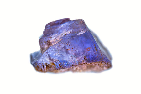Closeup natural rough Tanzanite gemstone on white background (Zoisite group minerals) (selective...