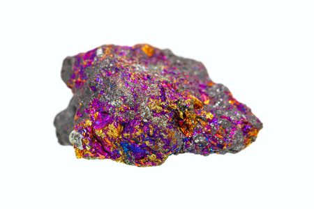 Closeup natural rough Bornite (Peacock ore) on white background, copper ore mineral (selective focus)の写真素材