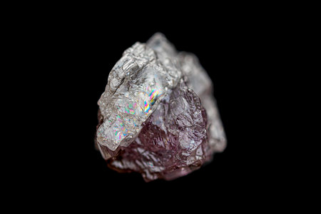 Closeup natural rough uncut purple diamond crystal on dark background (selective focus)の写真素材