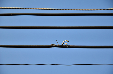 Defective wiring with sky backgroundの写真素材