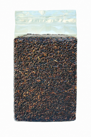 Unpolished rice in vacuum packaging isolate on white background.の写真素材