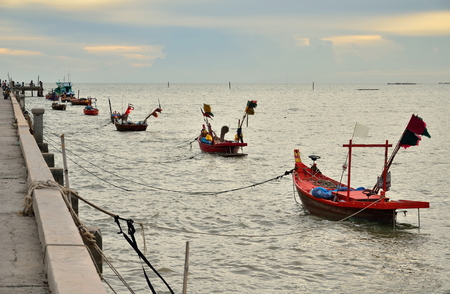 Fishing boat floating on the waterの写真素材