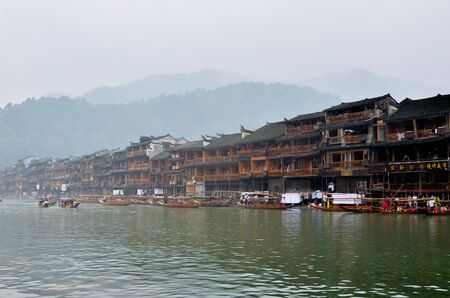 HUNAN, CHINA - JUNE 16, 2014 : Old houses in Fenghuang county in Hunan, China. The ancient town of Fenghuang was added to the World Heritage Tentative List in the Cultural categoryのeditorial素材