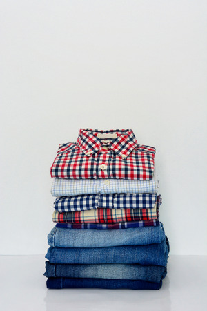 stack of clothing isolated on white, copy space