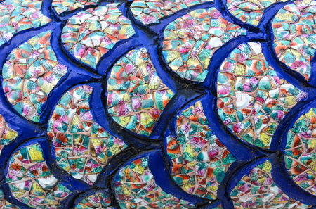 collage dragon scales, made from broken colorful ceramics bowlの写真素材